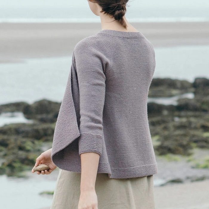 back view of Lady in Adromeda knitted cardigan