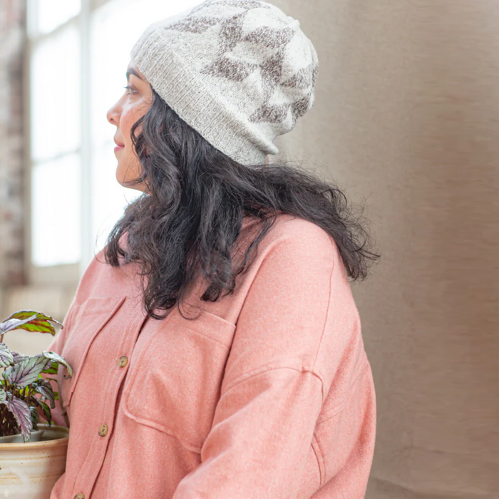 Young woman wearing Andraos hat in white and grey with Brooklyn Tweed Loft