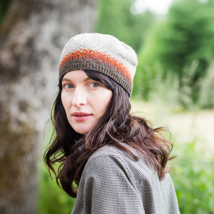 Woman wearing Sommers hat by Julie Hoover knitted with Brooklyn Tweed Loft