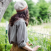 Backview of woman wearing Sommers hat knitted with Brooklyn Tweed Loft